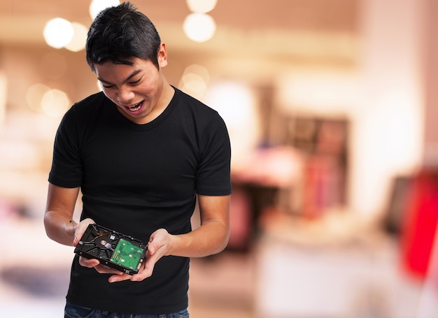 Free photo man looking at a hard disk