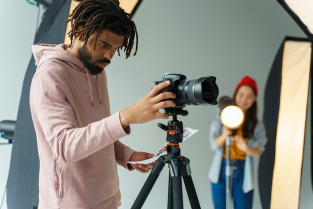 Man looking at his camera