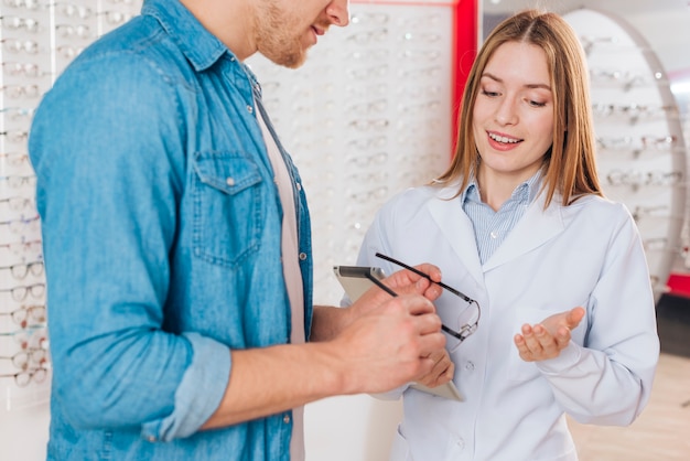 Man looking for new glasses at optometrist