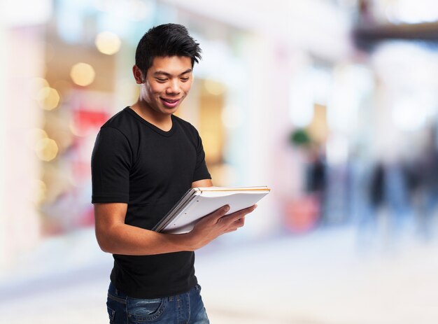 Man looking at an open notebook