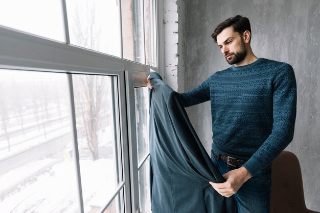 Man looking at suit