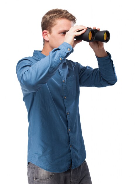 Man looking through binoculars