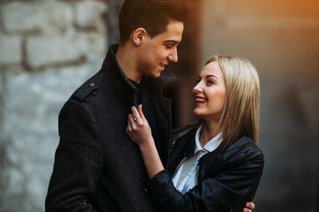 Man looking at woman and both smile