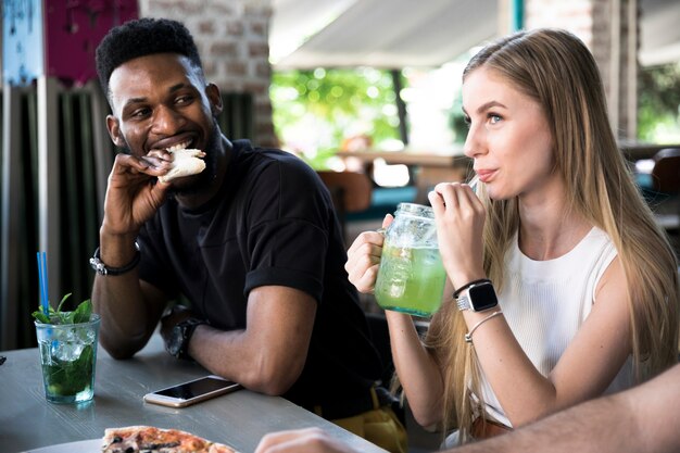 Man looking at woman at the table