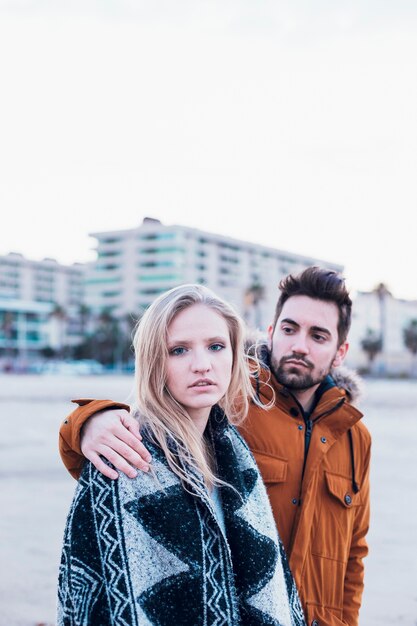 Man and lovely woman in blanket