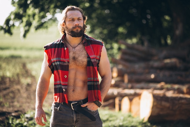 Man lumberjack in forest