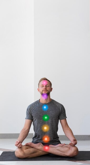 man maintaining asana while chakra points are aligned