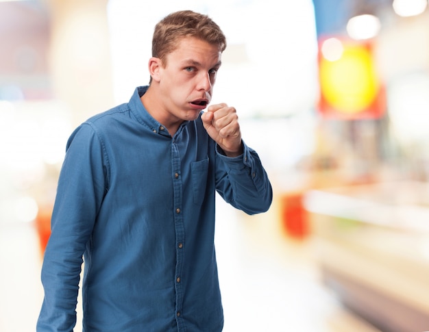 Man making a gesture with his hand and mouth