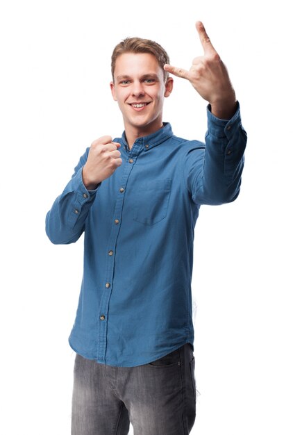 Man making horns with one hand