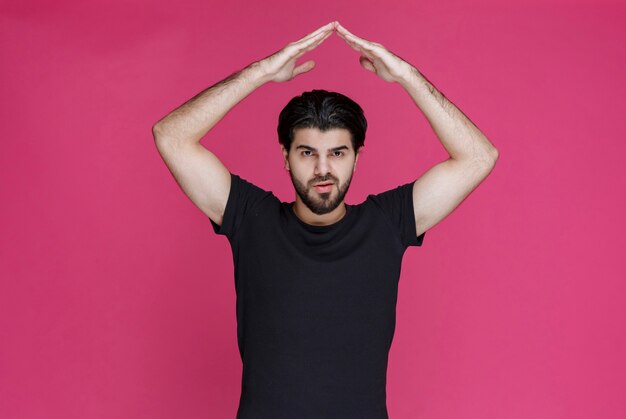 Man making meditation signs with hands