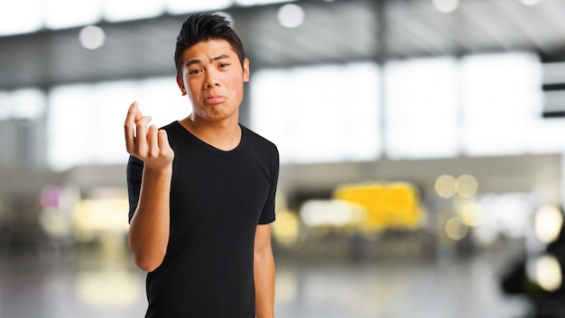 Man making money gesture while sad face