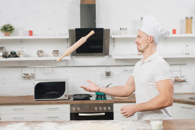 Man making pizza dough