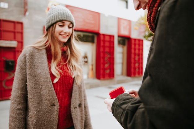 Free photo man making proposal on street