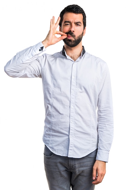 Man making silence gesture