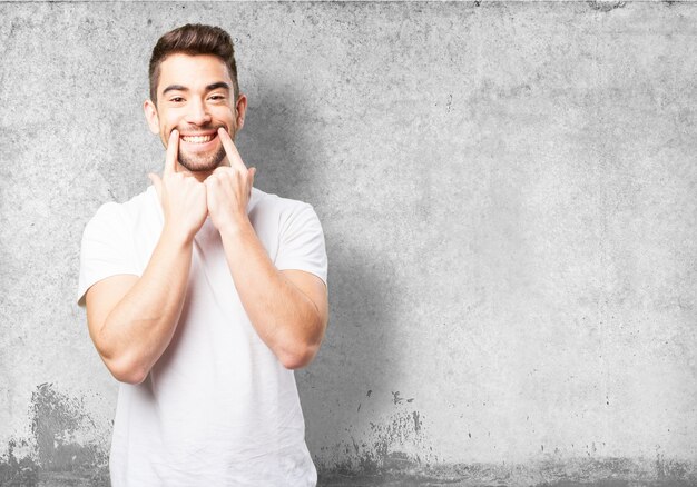 Man marking his smile with two fingers