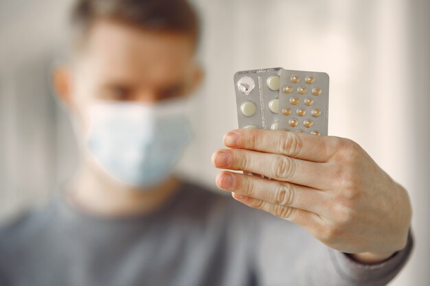 Man in a mask standing in the hall of hospital