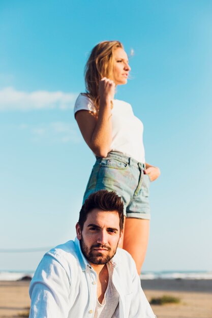 Man near woman on beach