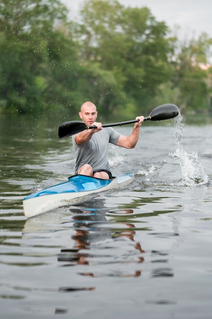 Man paddling rowing concept