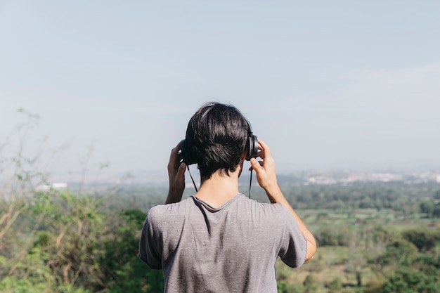 Man in park listening to music