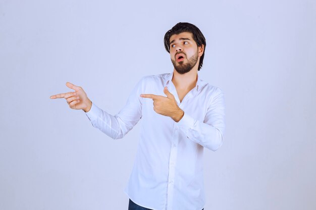 Man performing on the scene by referring to the spectators.