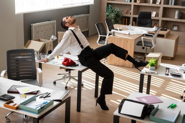 Man performing vogue dance indoors