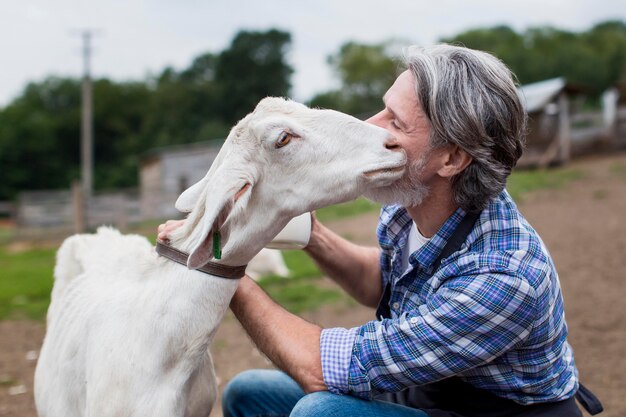 Man petting goat