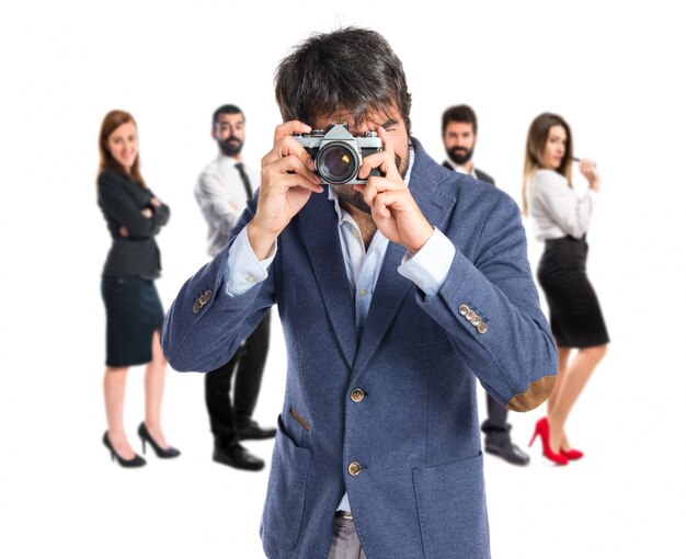 Man photographing over white background