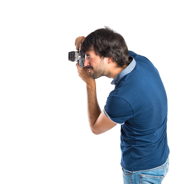 Free photo man photographing over white background