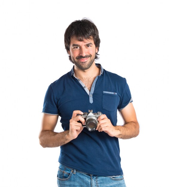 Man photographing over white background