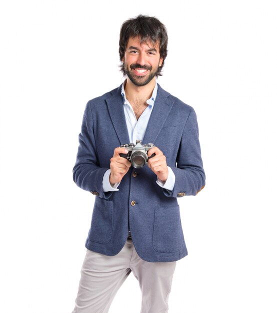 Man photographing over white background