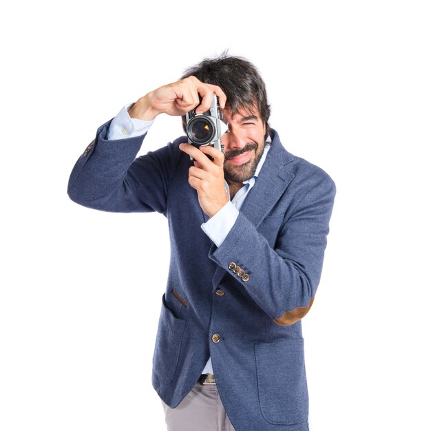 Man photographing over white background