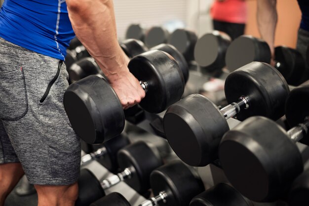 Man picking up weights from the rack