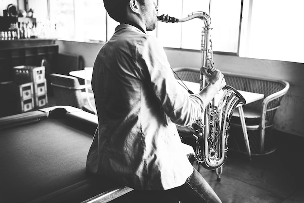 Man playing saxophone alone