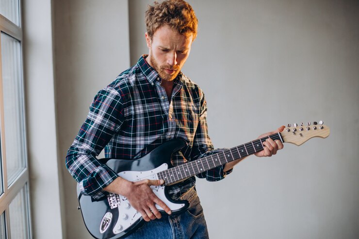 Free Photo man playing solo on the guitar