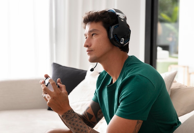 Man playing a video game with his console