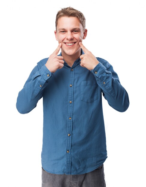 Man pointing his smile with his fingers