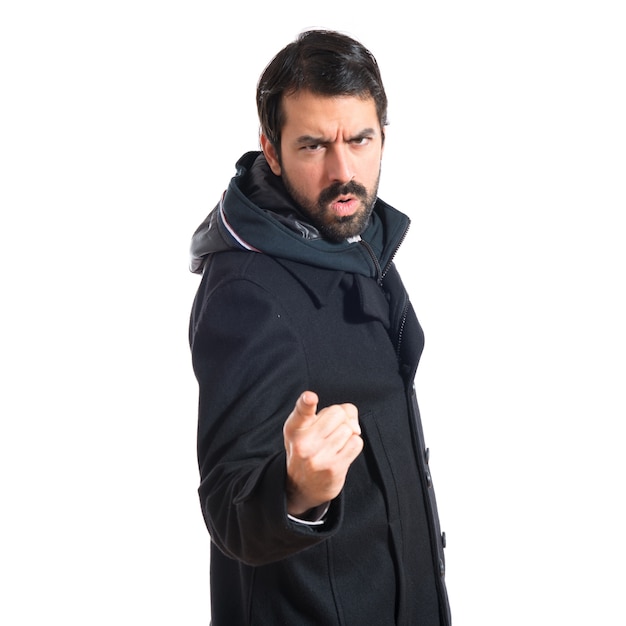 Man pointing and shouting over white background