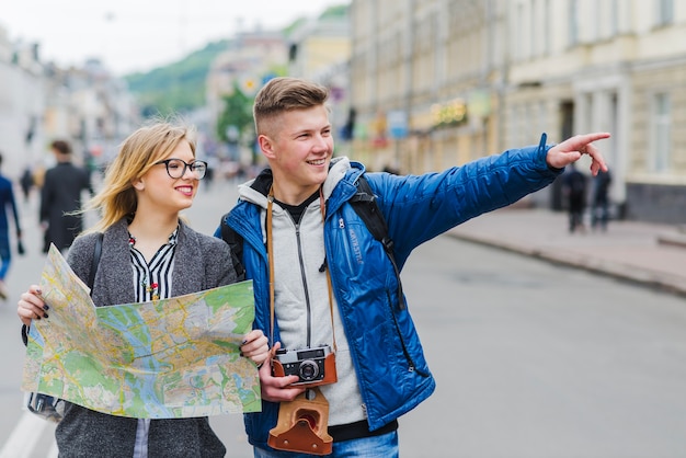 Free photo man pointing and showing sight to woman