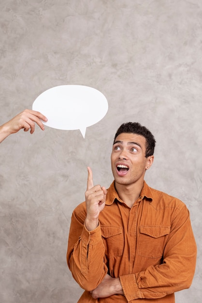 Man pointing up a speech bubble 