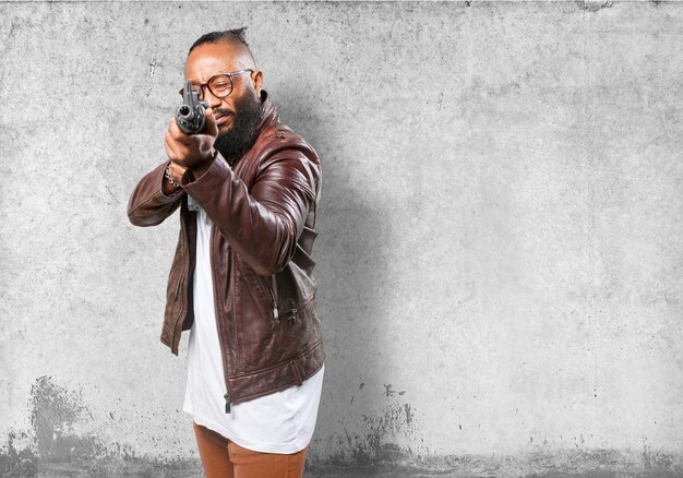 Man pointing with a submachine gun