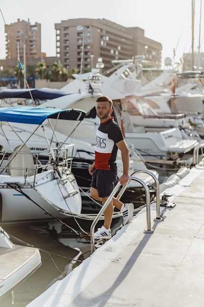 a man in the port preparing the yacht for the trip