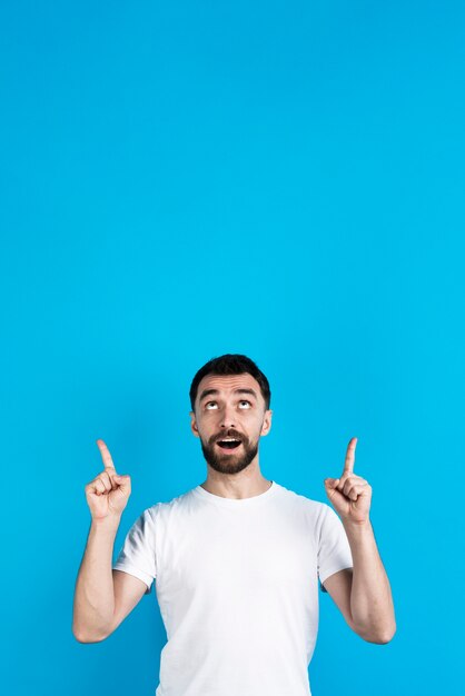 Man posing and pointing up