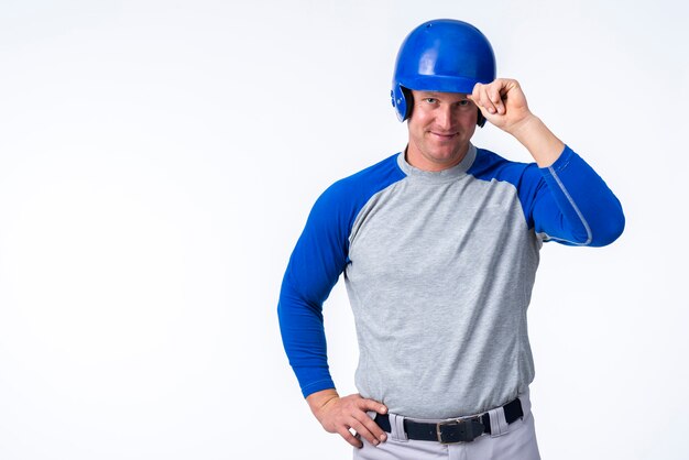 Man posing with baseball hat