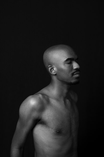 Man posing with dark background medium shot