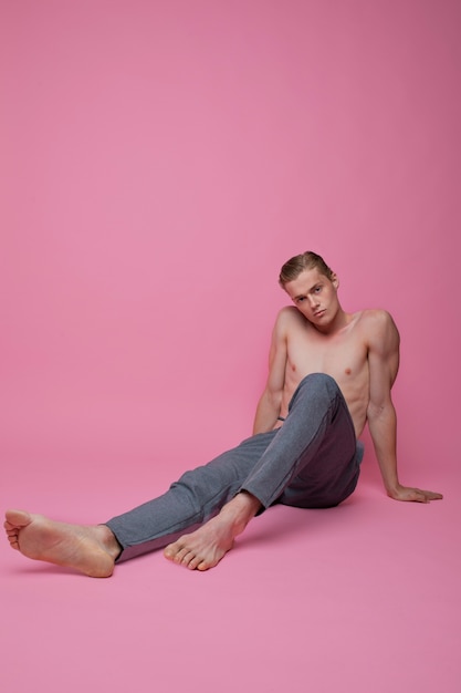 Free photo man posing with pink background