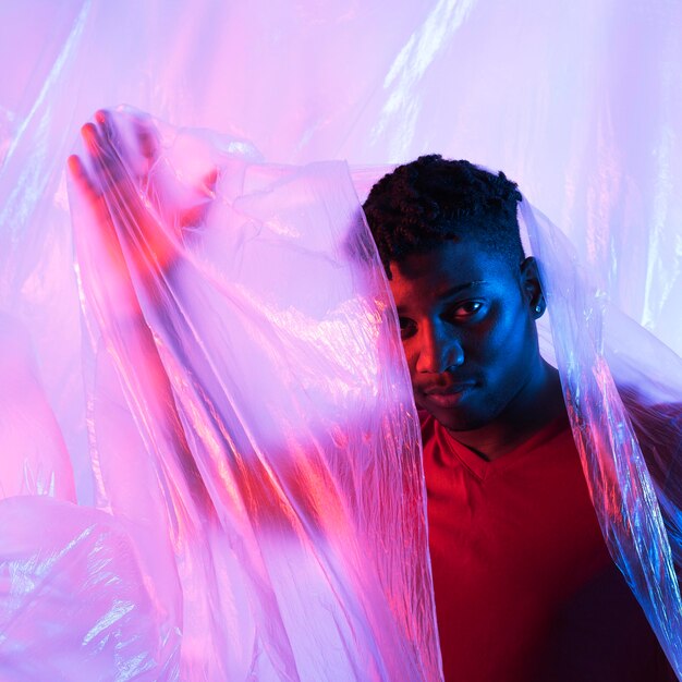 Man posing with plastic foil