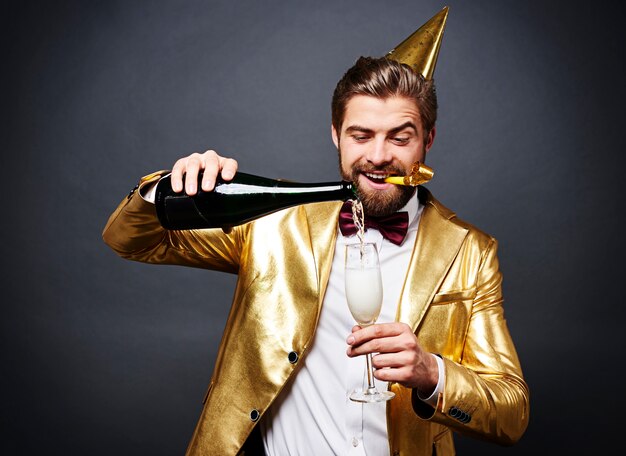 Man pouring champagne into champagne flute