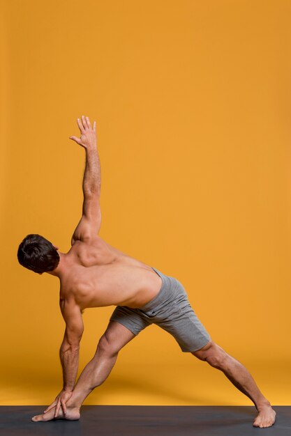 Man practicing in yoga position