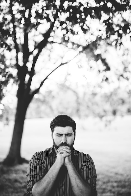 Man praying on the park