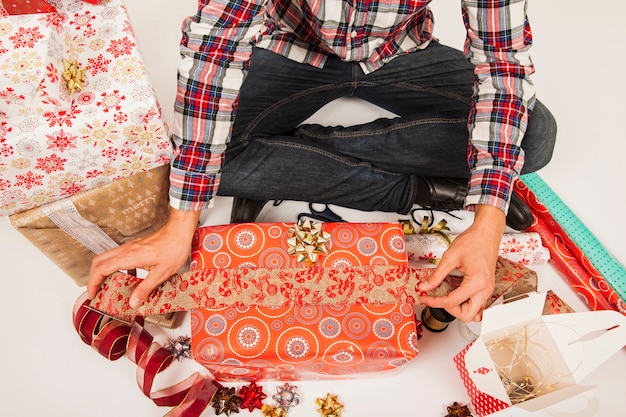 Man preparing gift boxes